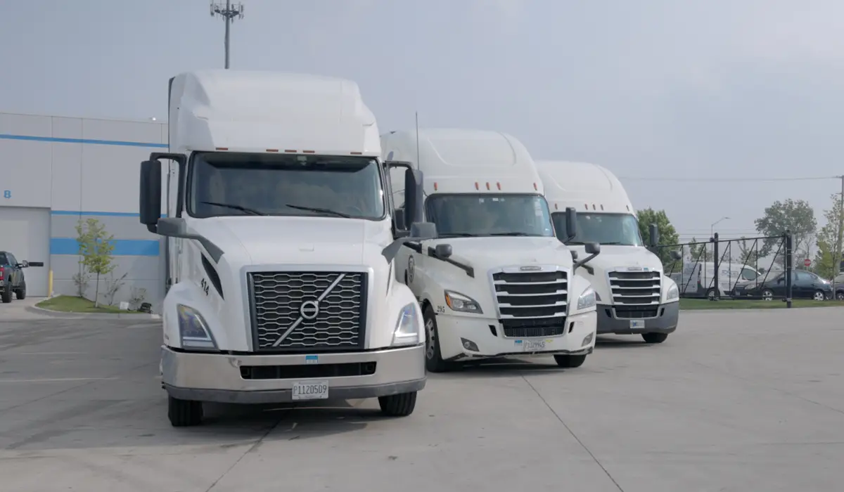 three white cargo trucks or shipping logistics
