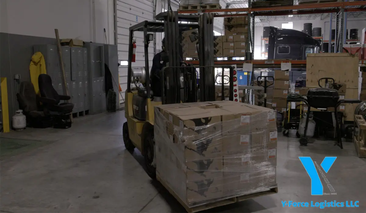 a forklift carrying boxes in a warehouse